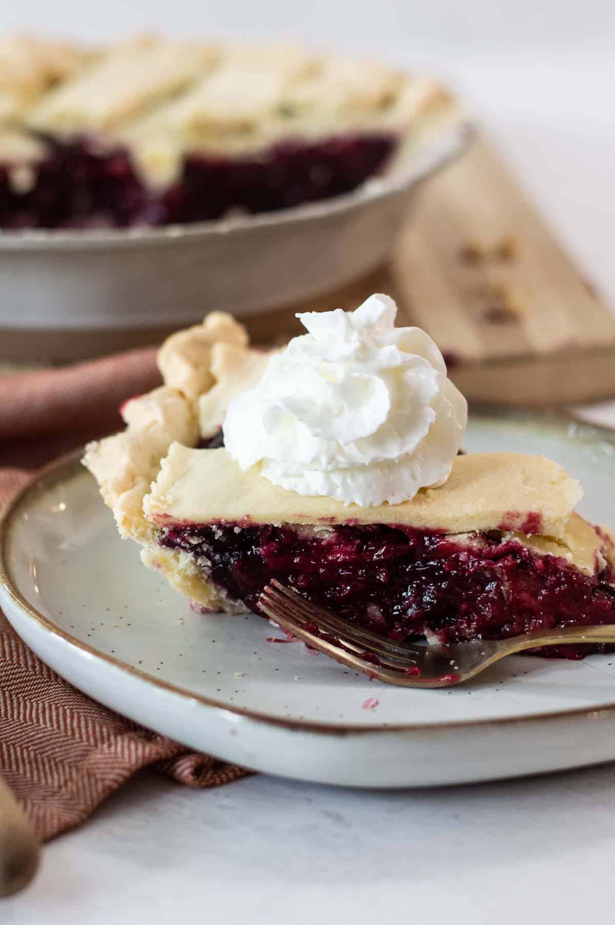 Easy Razzleberry Pie on a plate sliced