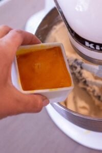 gluten free cheesecake filling being made with egg yolks