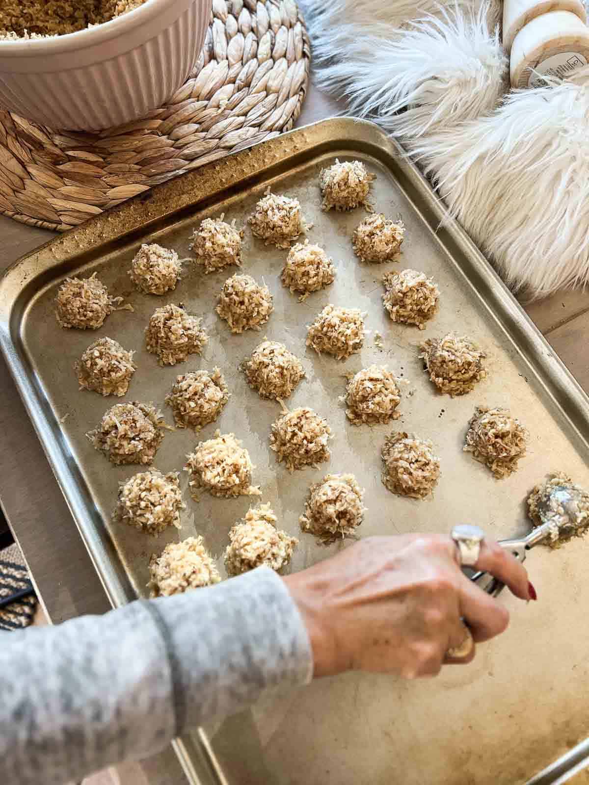 Coconut macaroons going on a tray