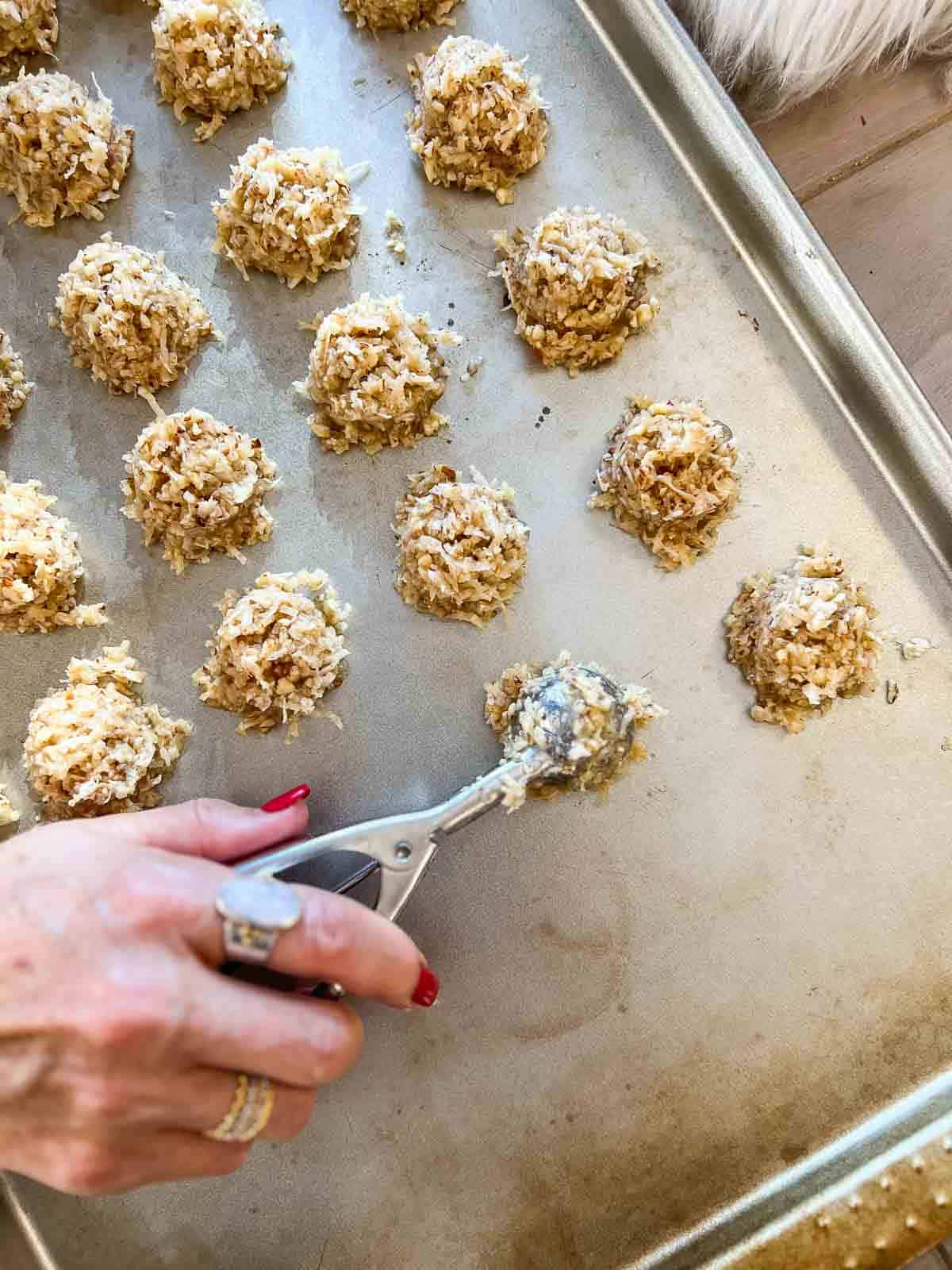 Coconut macaroons going on a tray