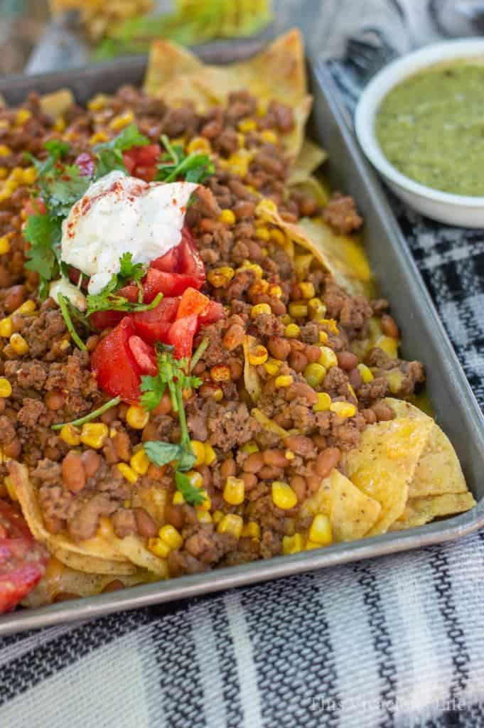 Gluten Free Baked Bean Nachos make a wonderful weeknight dinner because it’s both easy to make and to clean up. || This Vivacious Life #recipe #nachos #easydinner #dinner #dinnerrecipes #easyrecipe #nachorecipe #glutenfree #glutenfreedinner #thisvivaciouslife