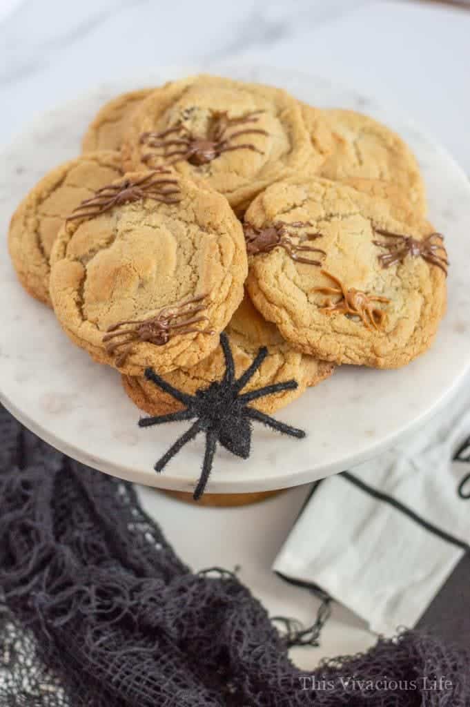 Spider chocolate chip cookies! These delicious and spooky Halloween cookies are sure to please any little ghost or goblin. They only take a few extra minutes from your classic gluten-free chocolate chip cookie too. || This Vivacious Life #recipe #cookies #halloween #spidercookies #halloweendesserts #thisvivaciouslife