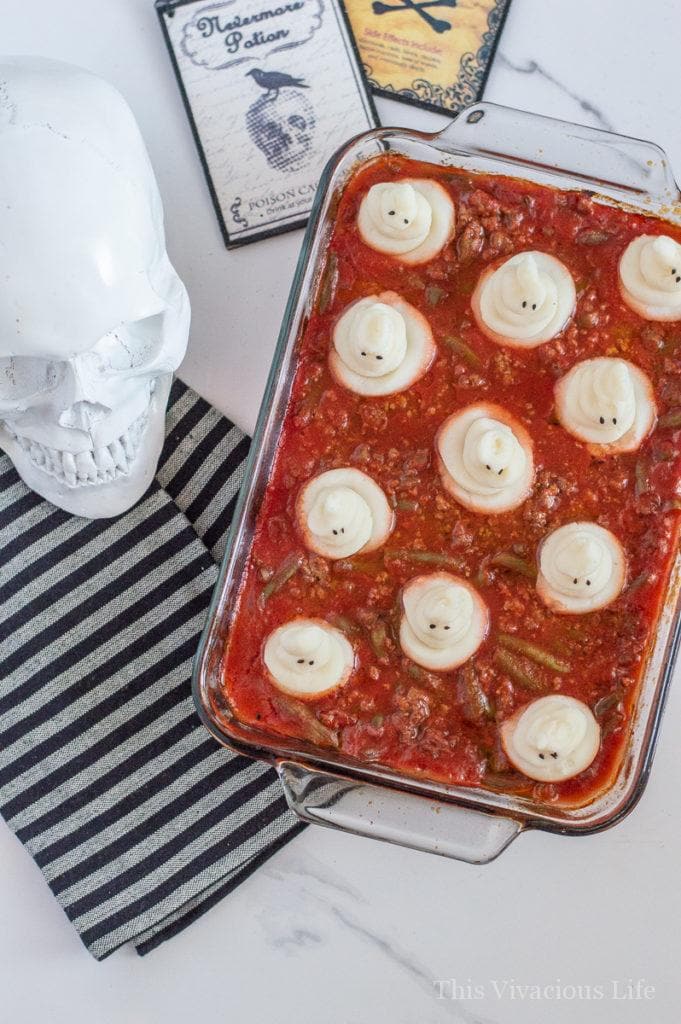 Halloween dinner of spooky shepherds pie in a glass dish