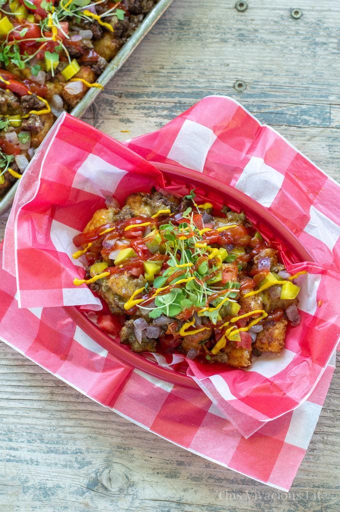 Cheeseburger loaded tops in a checkered serving basket