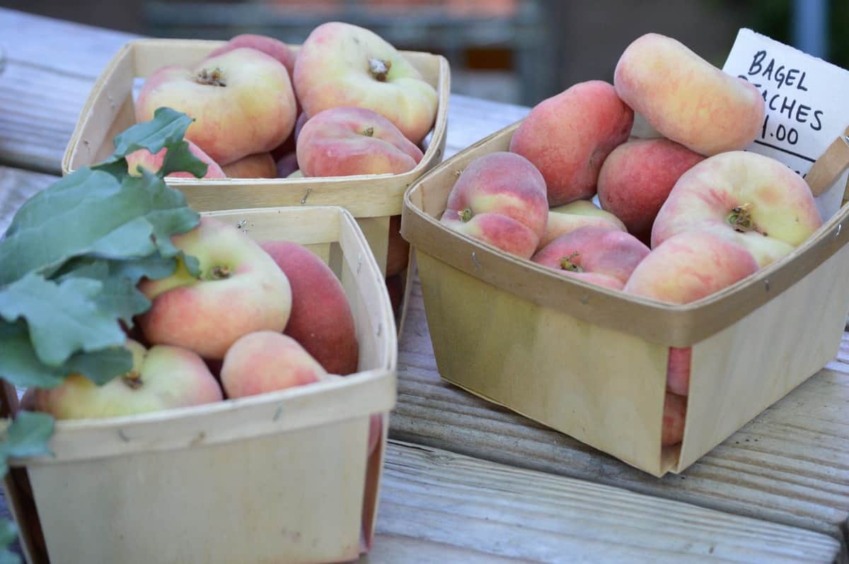 Fresh peaches in wicker baskets