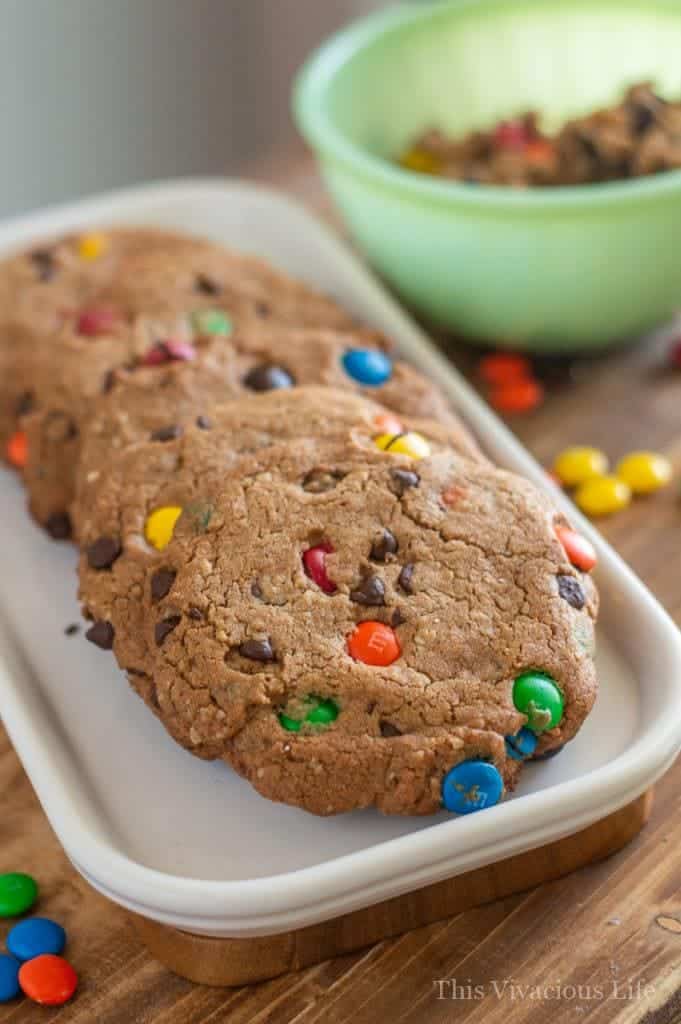 Gluten-free monster cookies! These are so easy and because they are semi-homemade, they won't have you slaving in the kitchen all day to make. With just the right amount of honey, gluten-free oats, and plenty of chocolate, you can't go wrong with this kids favorite m&m cookie!