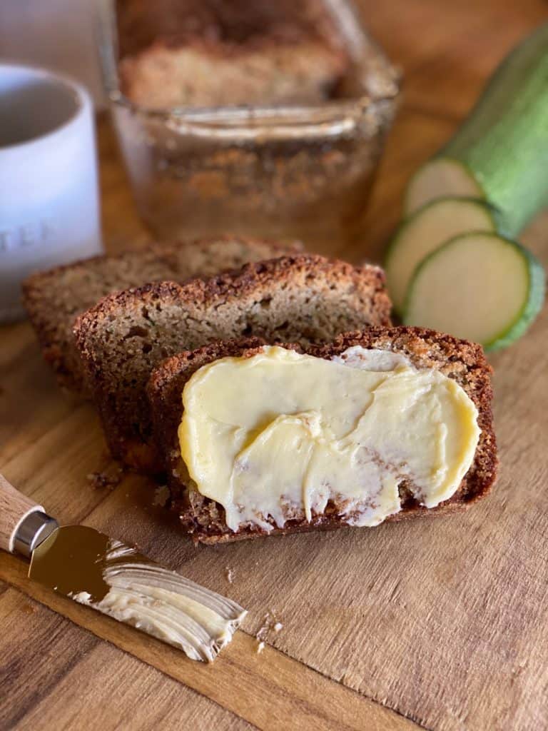 gluten-free zucchini bread sliced with butter