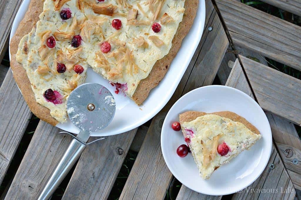 This white cream, turkey and cranberry pizza makes an amazing Thanksgiving leftover meal that everyone will love! | thanksgiving leftover recipes | thanksgiving leftovers | gluten-free thanksgiving leftovers | gluten-free pizza | thanksgiving leftover ideas || This Vivacious Life #thanksgivingleftovers #thanksgivingleftoverrecipes #glutenfreepizza