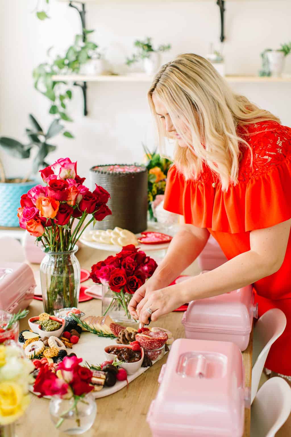 Lady in red decorating Galentines table