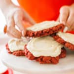 Red velvet cake mix cookies on a marble cake stand