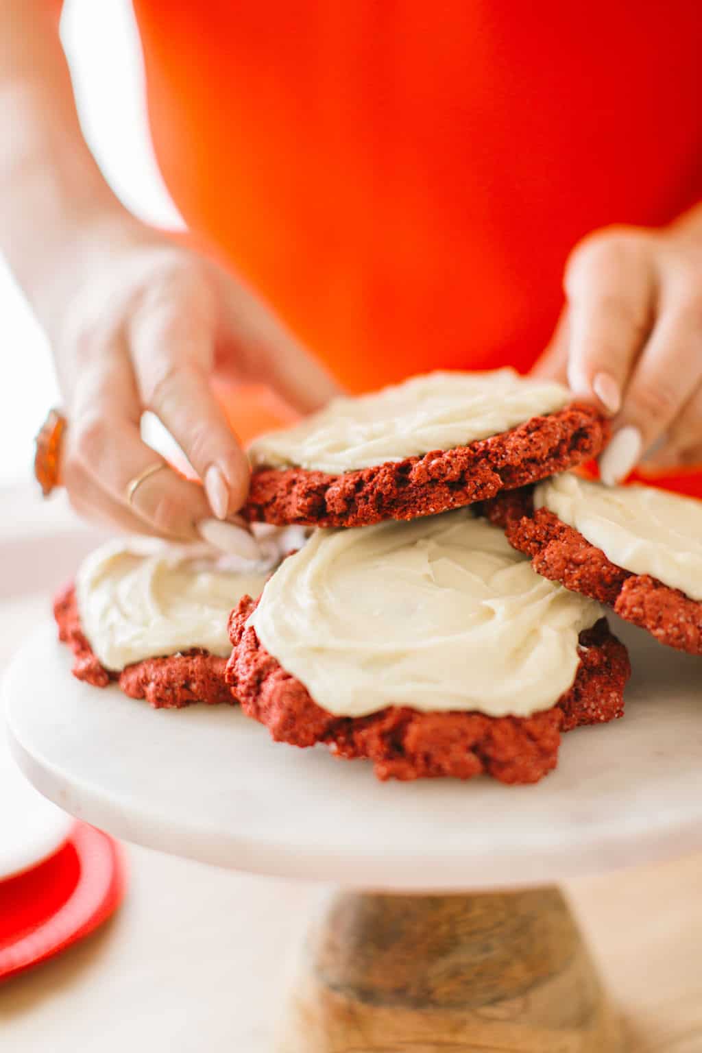 Red velvet cake mix cookies on a marble cake stand