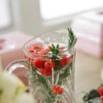 Raspberry rosemary mocktail in crystal pitcher