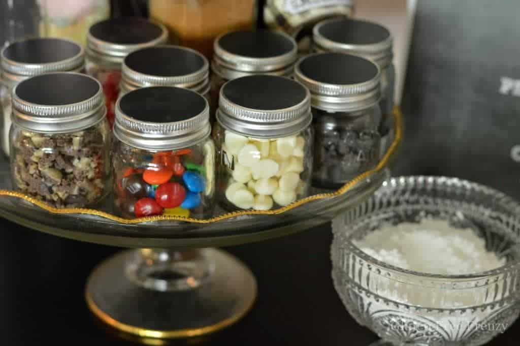 The works pretzel toppings station complete with 18 different toppings just like on the pretzel day episode of The Office. This would be perfect for a pretzel bar or party! www. glutenfreefrenzy.com