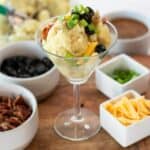 mashed potatoes in a martini glass with toppings