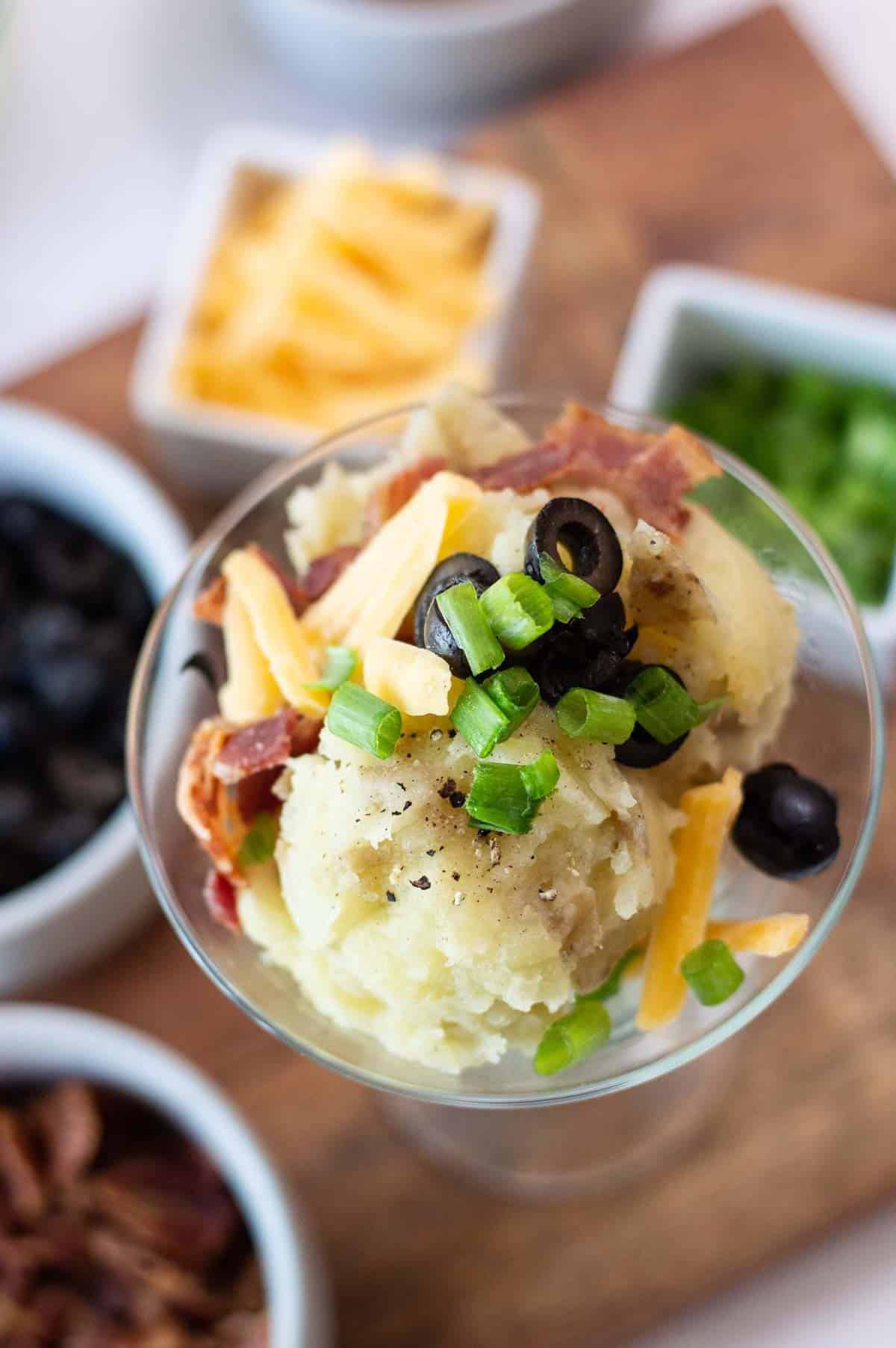 mashed potatoes in a martini glass with toppings