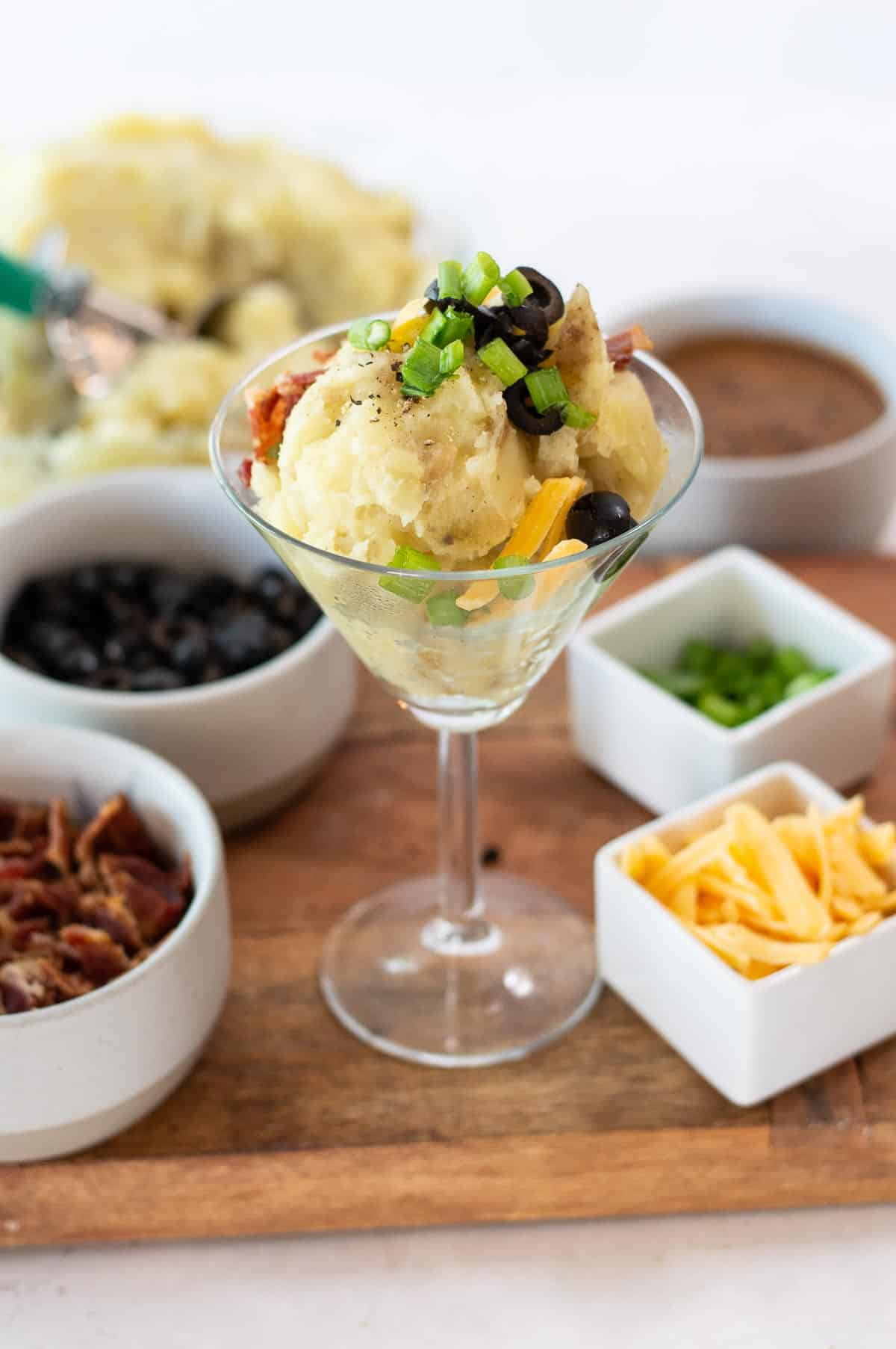 mashed potatoes in a martini glass with toppings