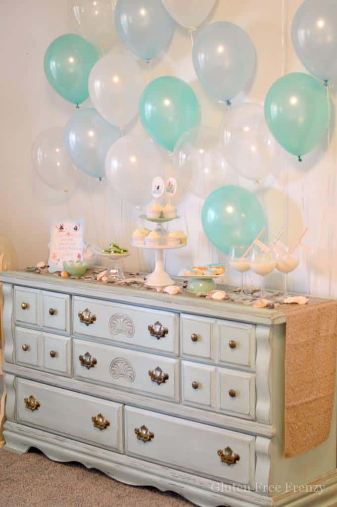 This mermaid themed baby shower couldn't be cuter! So great for little girls but also works as a gender neutral shower with all the white, baby blue and mint green. Clam cookies made from macaroons are so gorgeous and those little mermaids and mermaid tails were darling too! PLUS a DIY diaper cupcake tutorial and more... glutenfreefrenzy.com