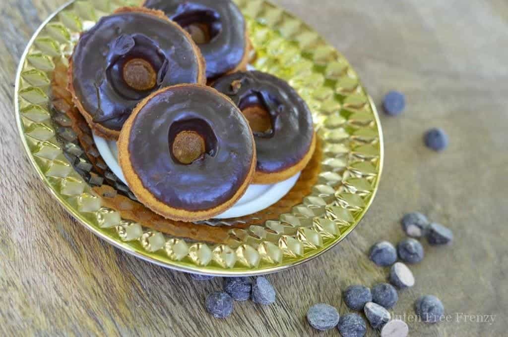 How delicious are these chocolate dipped pumpkin spice donuts?! SO yummy and easy to make! They are also gluten-free, dairy-free and so delicious that anybody will love them. Serve these tasty treats at your next Halloween party for a great dessert. glutenfreefrenzy.com