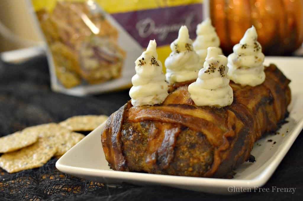 This bacon wrapped meatloaf is gluten-free and topped with ghost mashed potatoes. It is sure to be a Halloween dinner hit for the whole family. glutenfreefrenzy.com