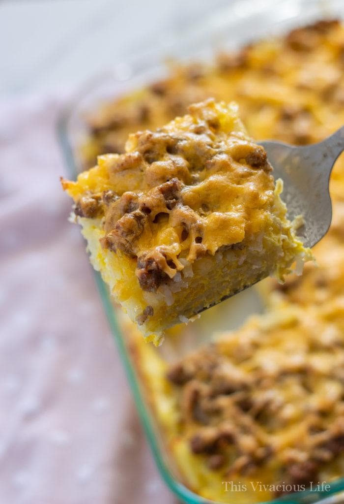 Gluten-Free Breakfast Casserole Square of hash brown breakfast casserole on a spatula