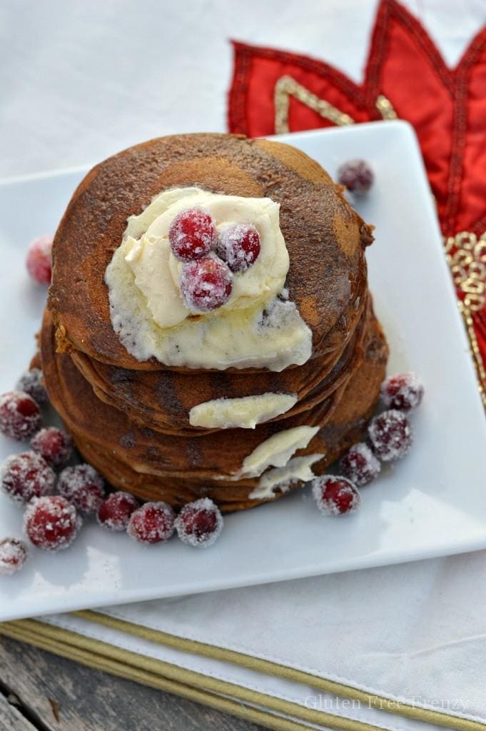 Oh holly jolly, these gluten-free gingerbread pancakes are full of holiday flavors and spices. They are so delicious nobody would ever know they are gluten-free. Serve them with sugared cranberries on top.