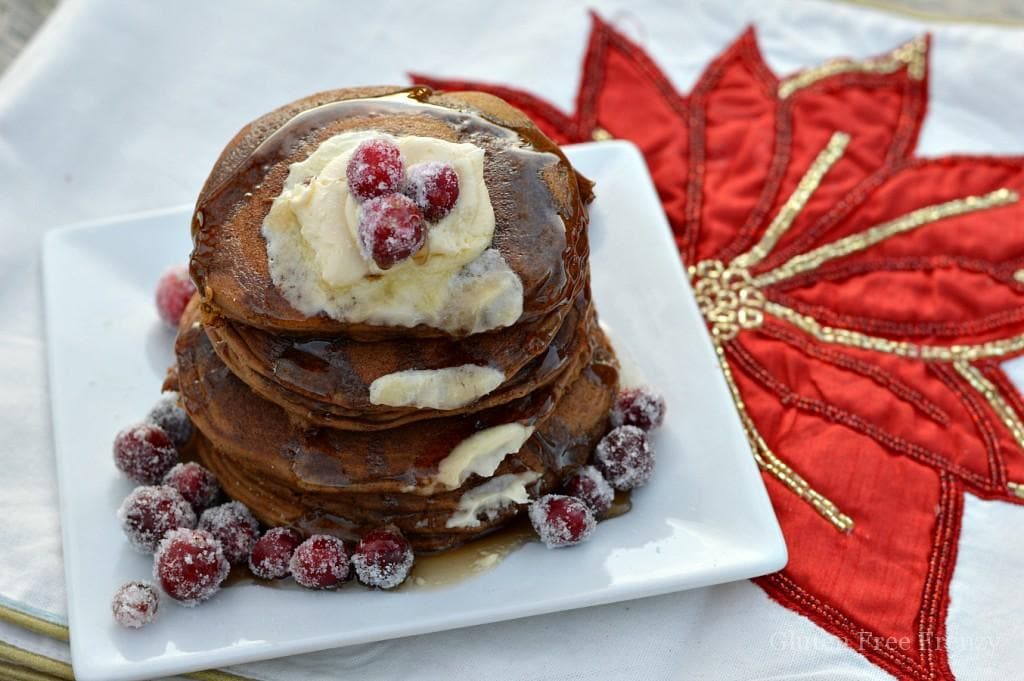 Oh holly jolly, these gluten-free gingerbread pancakes are full of holiday flavors and spices. They are so delicious nobody would ever know they are gluten-free. Serve them with sugared cranberries on top.