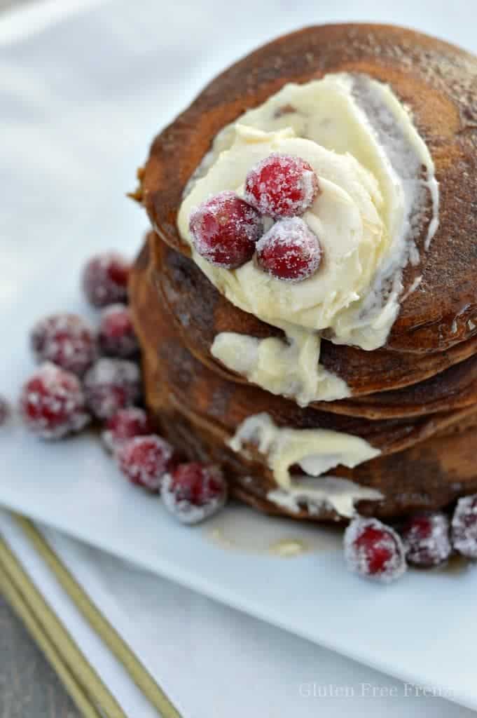 Oh holly jolly, these gluten-free gingerbread pancakes are full of holiday flavors and spices. They are so delicious nobody would ever know they are gluten-free. Serve them with sugared cranberries on top.