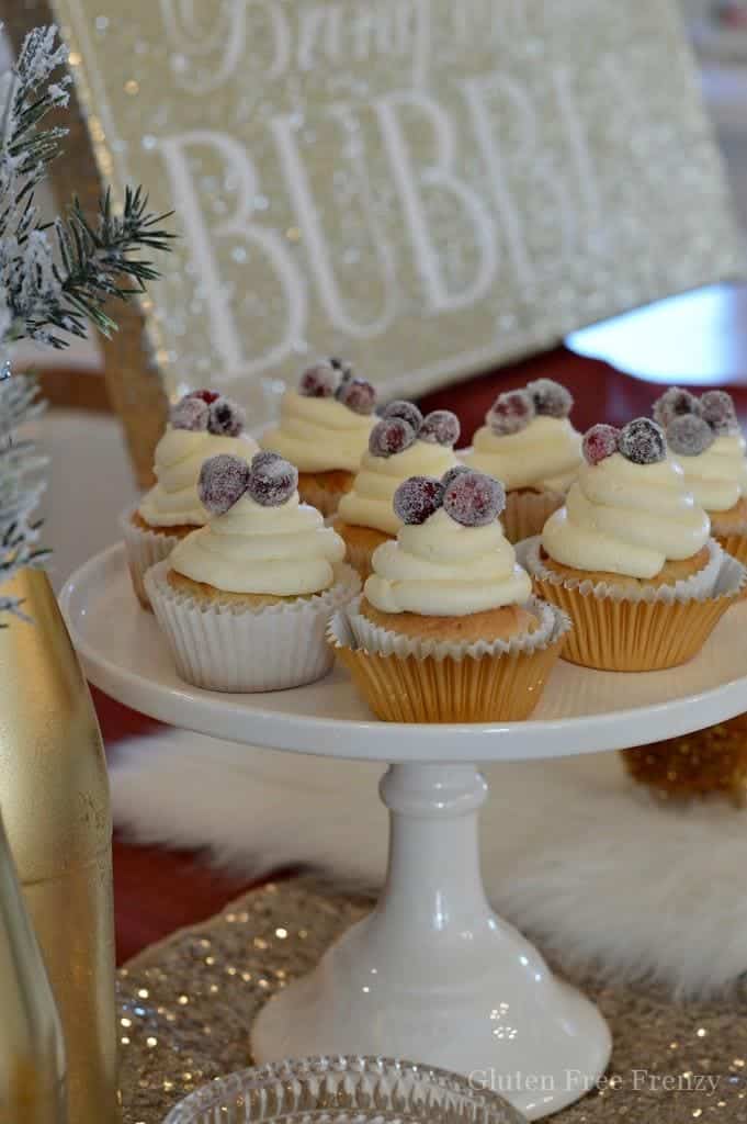 This glam New Years Eve party is sure to dazzle your guests. The sparkling cranberry cupcakes will make their tastebuds dance too.