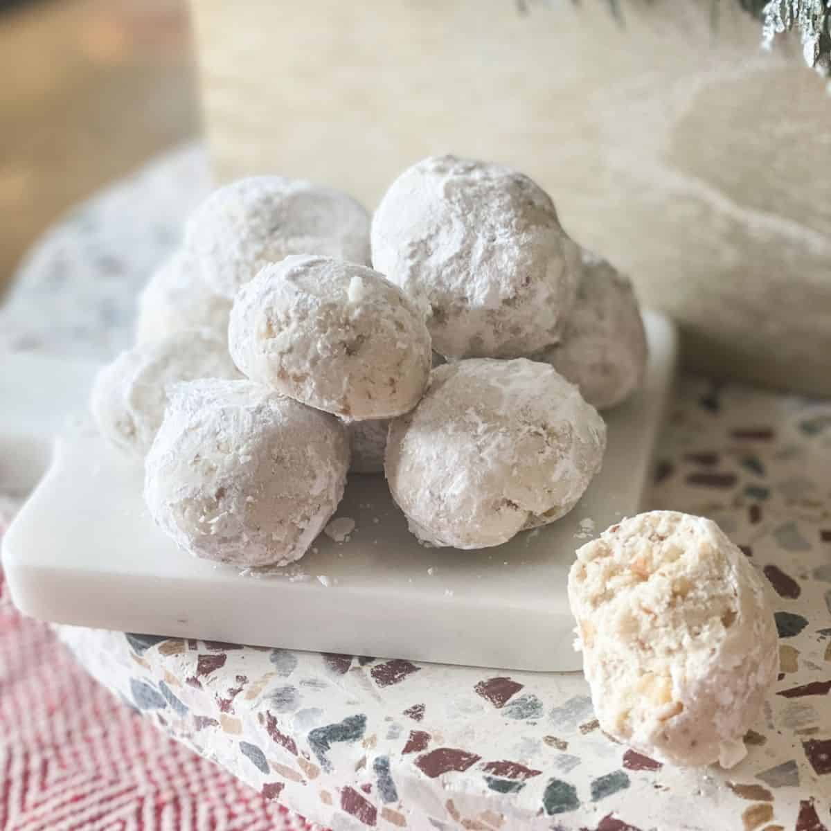 Gluten-Free Mexican Wedding Cookies on a marble board