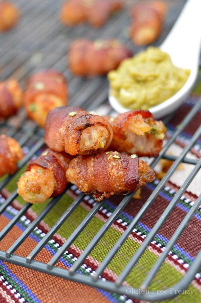 Guacamole stuffed tater tot bacon bombs are going to be a HUGE hit at your next gathering. They are the perfect appetizer for New Years Eve or Superbowl.