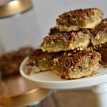 These gluten-free pecan pie shortbread bars are truly decadent in every way. They are rich and buttery. Nobody would ever know this fall dessert is gluten-free. Take classic pecan pie flavors and put them in a more mobile bar with these treat.