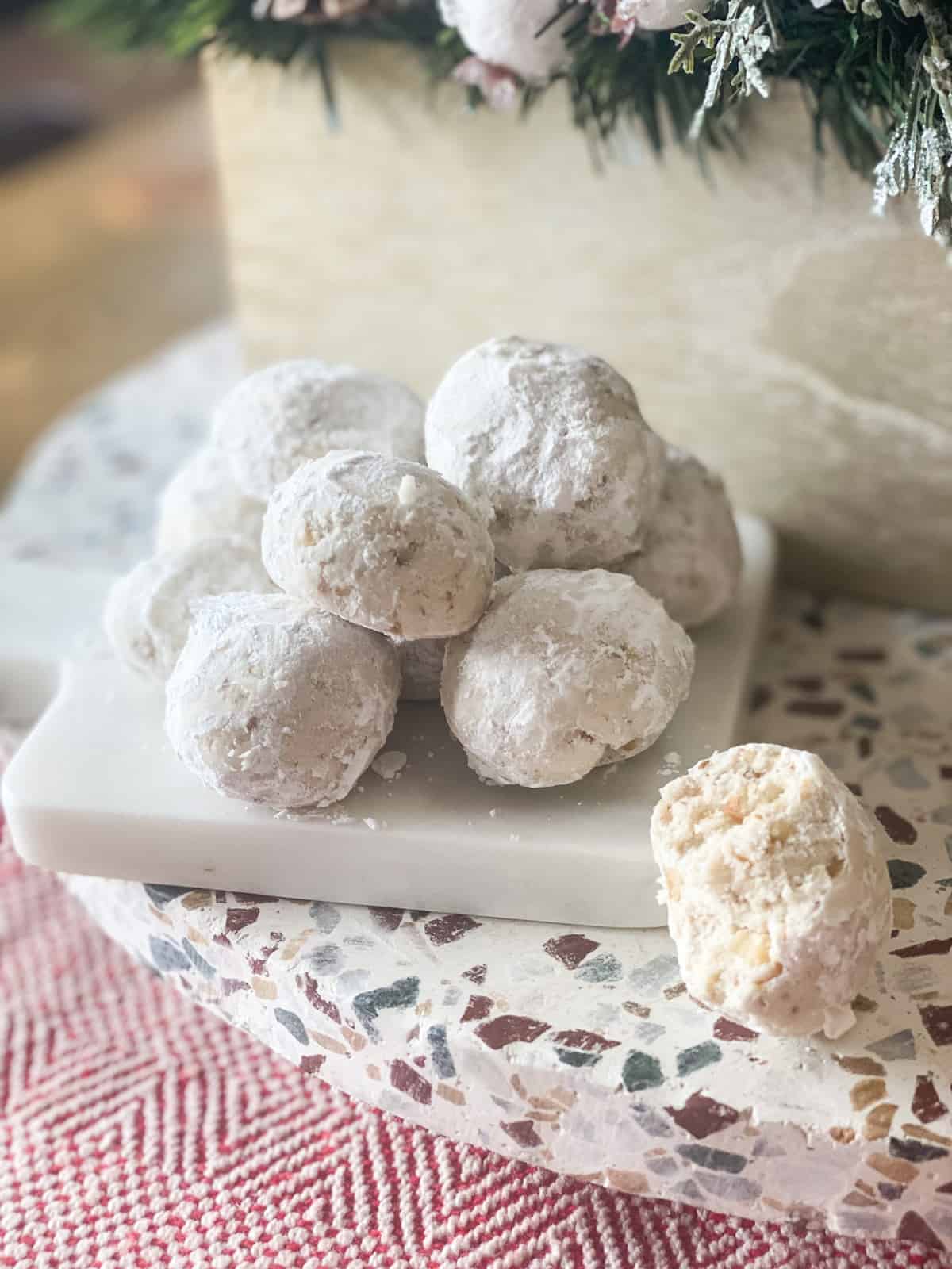 Gluten-free Mexican wedding cookies on a marble tray
