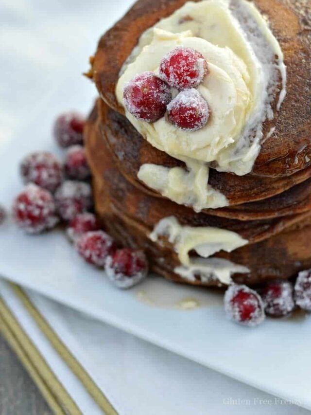 gluten-free gingerbread pancakes with sugared cranberries on top