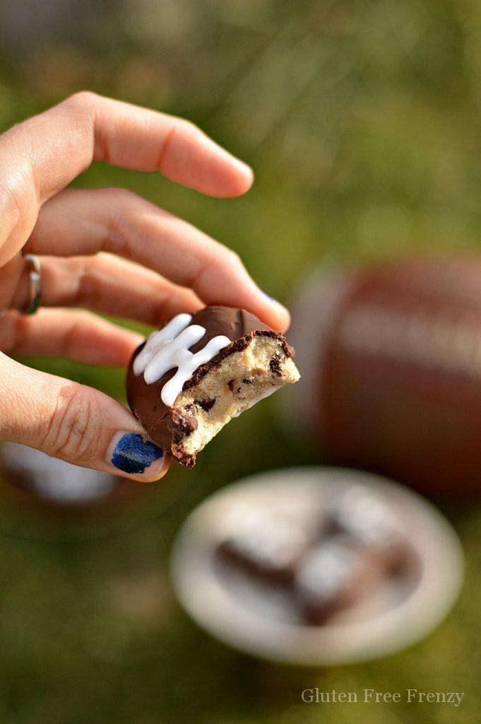 Gluten-free cookie dough footballs in a hand