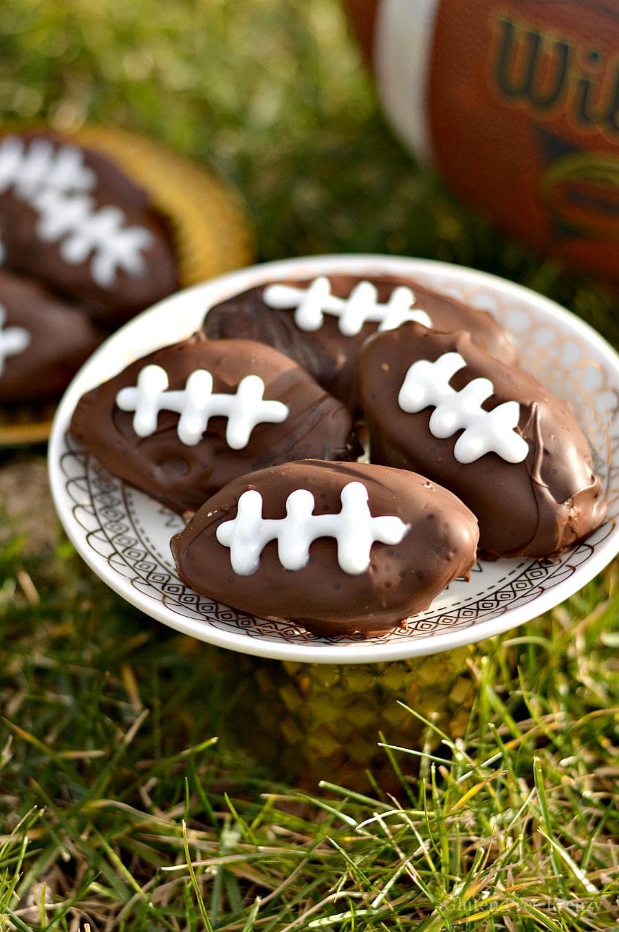These gluten-free cookie dough footballs are perfect for your next sports night or Superbowl party. They are easy to make and everyone will love them!