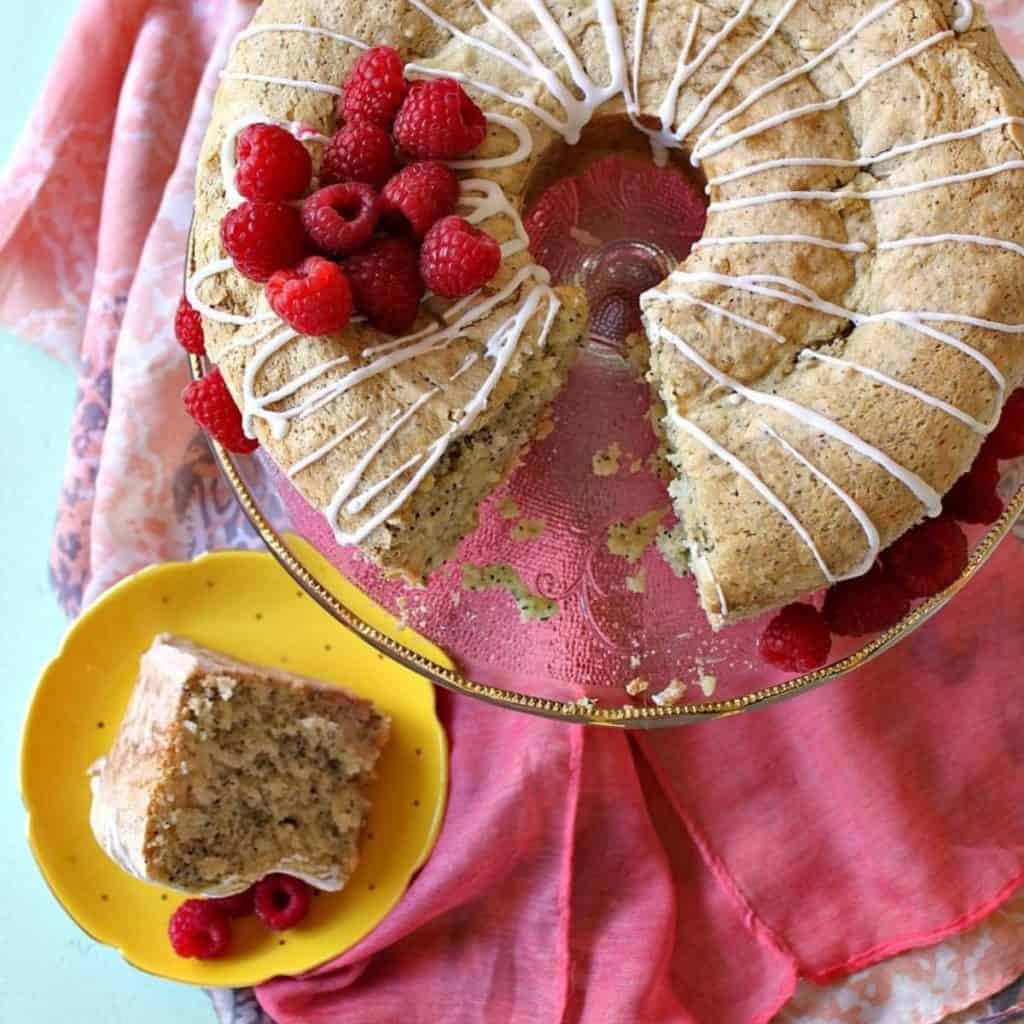 Gluten-Free Lemon Poppyseed Cake on a cake stand