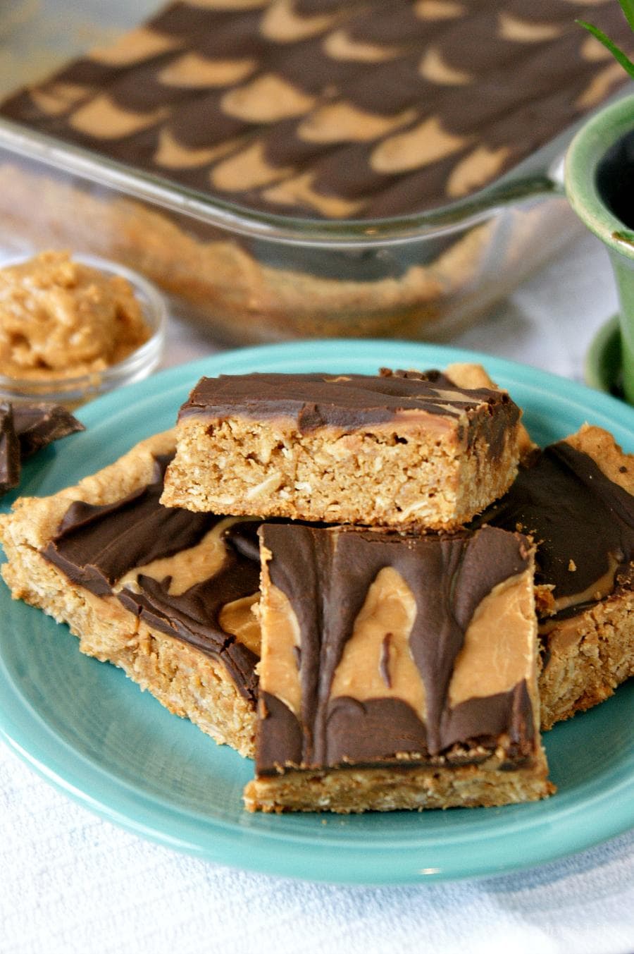 These gluten-free peanut butter bars with chocolate peanut butter frosting are a decadent treat that everyone will enjoy! They are easy to make and are a chewy and rich dessert.