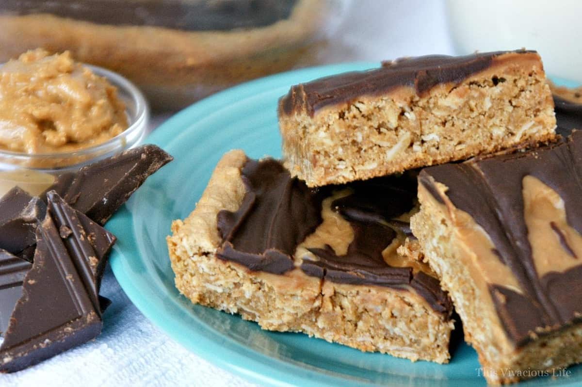 Three peanut butter bars on a blue plate