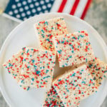 This 4th of July backyard bash and fruit salad are sure to put your party guests in the patriotic spirit! We have everything you want in red, white and blue including snow cone sugar cookies, pop rock cupcakes and even yard yahtzee!