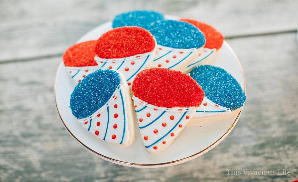 Snow cone sugar cookies on a white plate