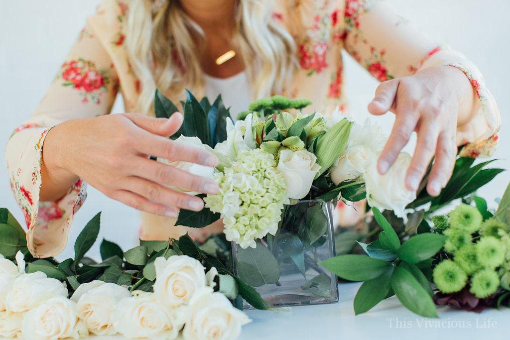 These simple white flower arrangements are easy to put together and are only around $15 each!
