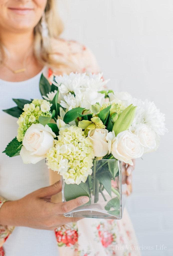 Girl holding modern flower arrangements