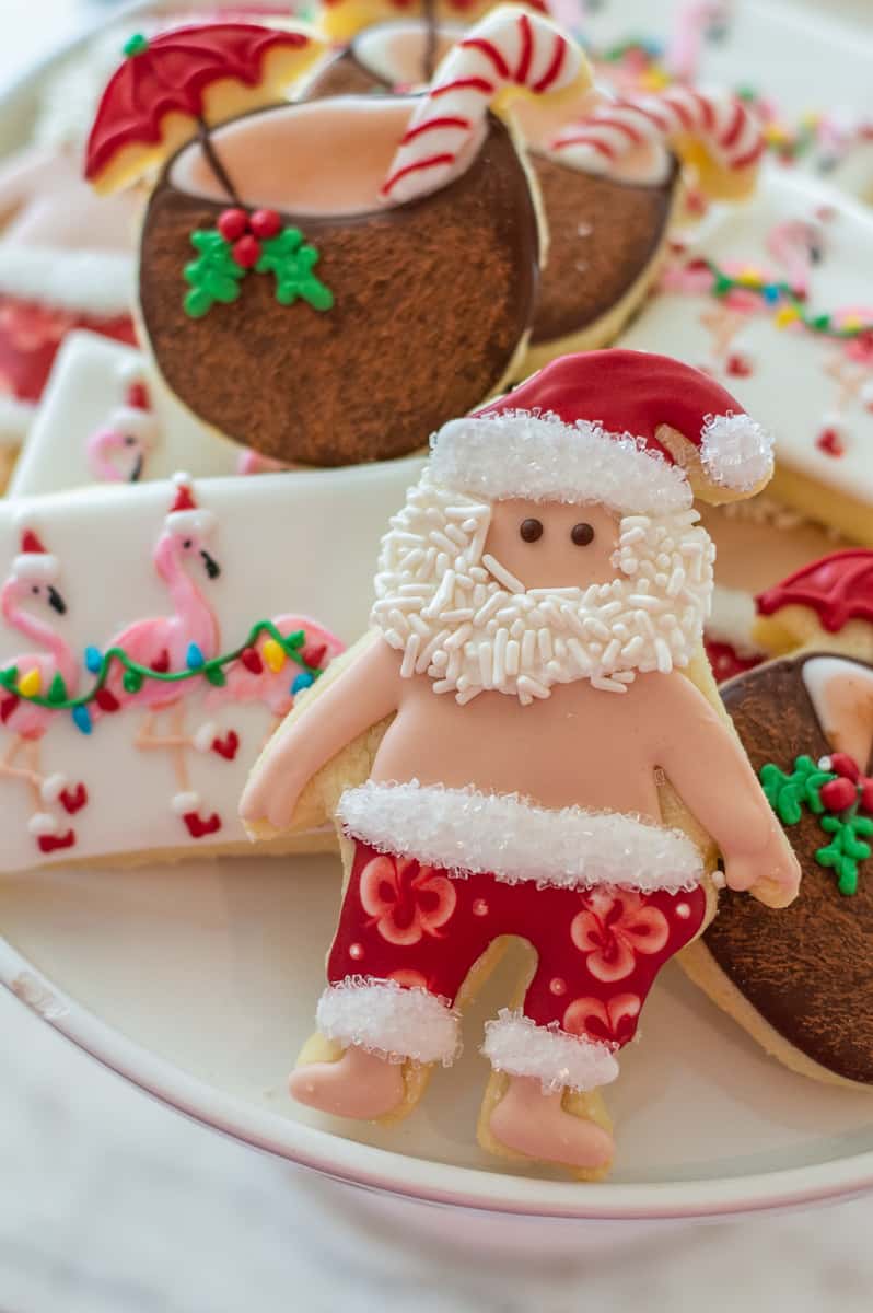 Christmas in July sugar cookies on a cake stand