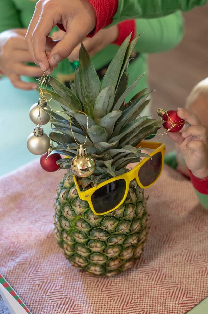 Pineapple decorated with mini bulbs and sunglasses