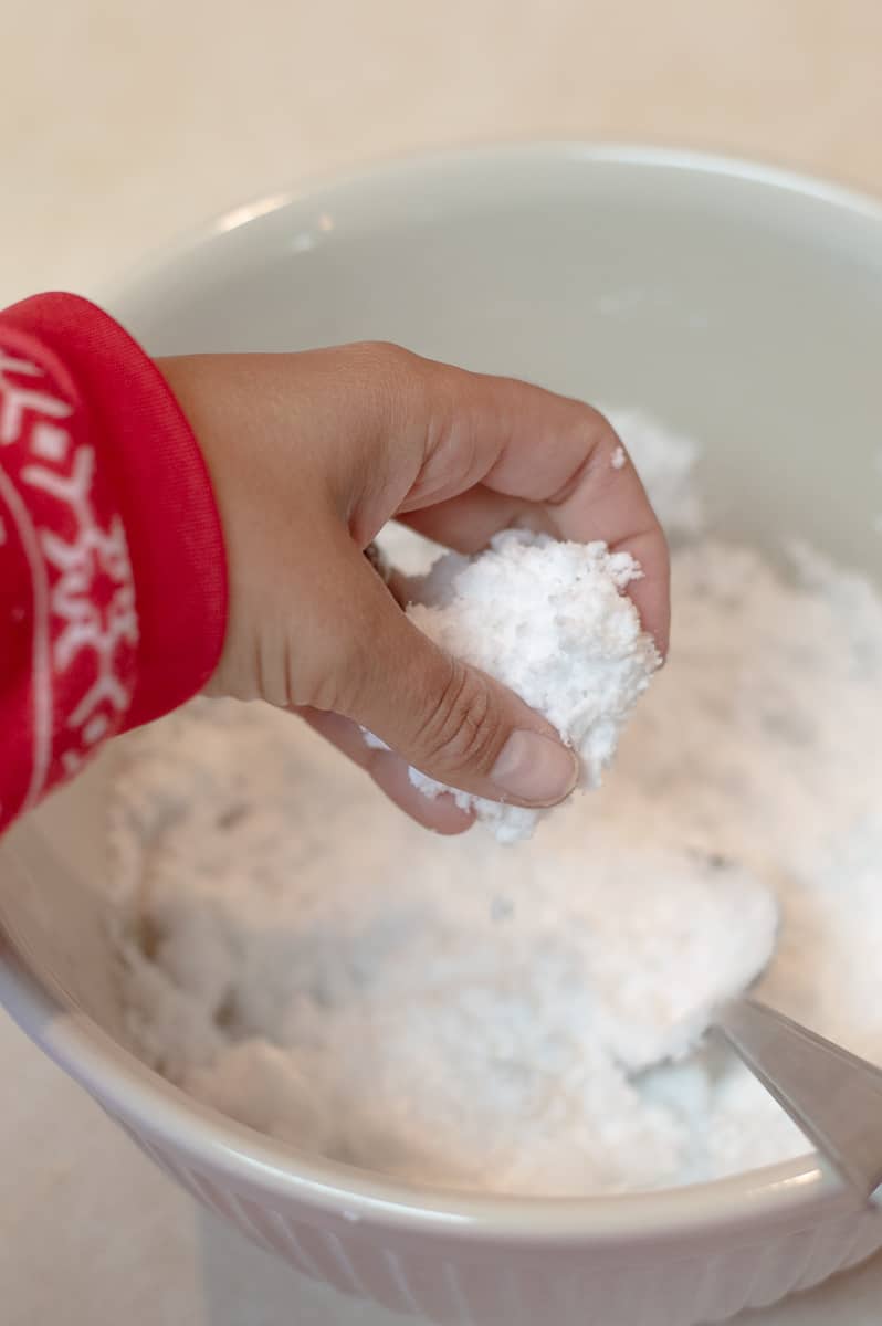 Hand holding homemade snow