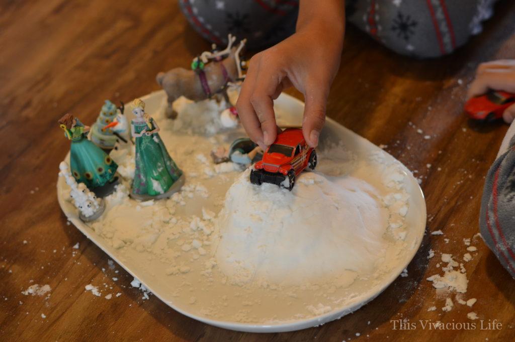 Homemade snow on a tray with toys