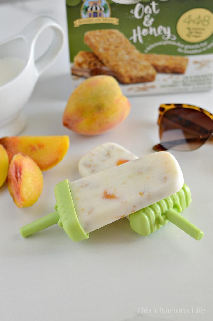 These gluten-free peach granola yogurt pops are a great summer treat that is both delicious and nutritious. | gluten free summer recipes | gluten free popsicle recipes | homemade popsicle recipes | recipes using fresh peaches | peach popsicle recipes | yogurt pop recipes | cool summer treats | recipes for summer | kid friendly recipes | healthy treat recipes || This Vivacious Life