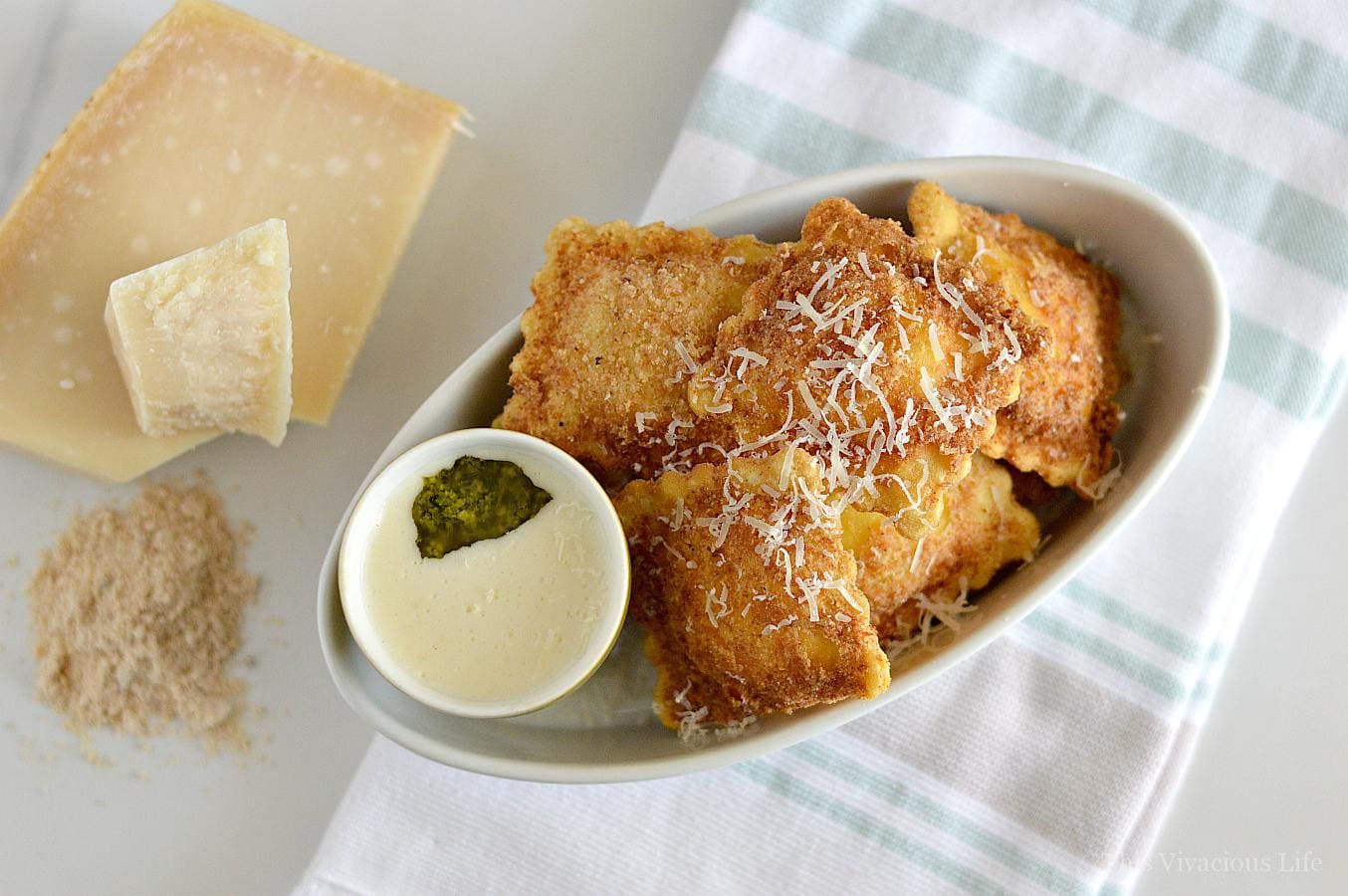 gluten-free fried ravioli with pesto Alfredo sauce