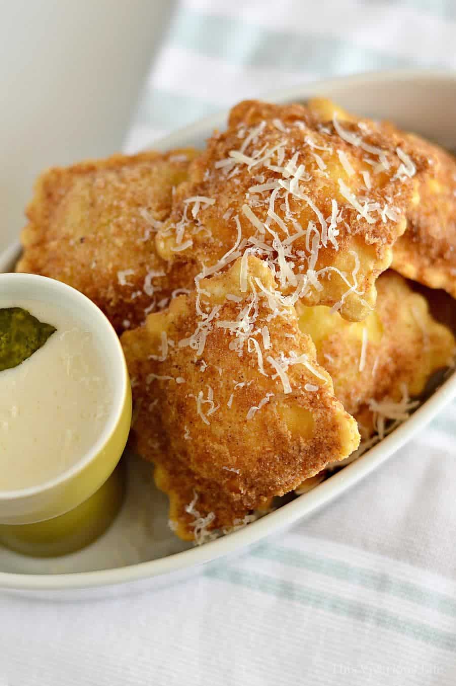 gluten-free fried ravioli with pesto Alfredo sauce