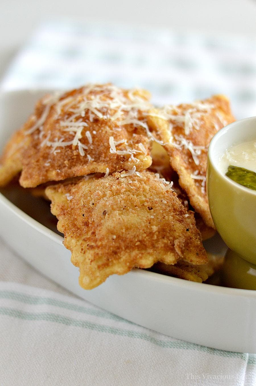 gluten-free fried ravioli with pesto Alfredo sauce